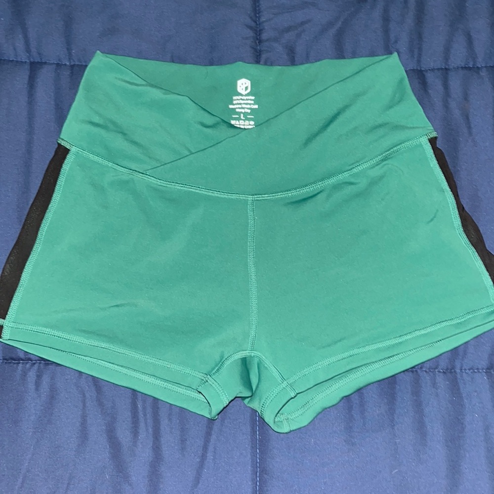Born Primitive woman’s green/blue workout shorts size Large. Never worn!